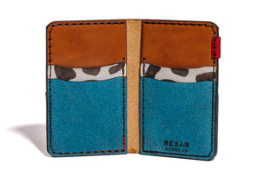 interior view of multicolor four pocket vertical wallet with red, blue, yellow, and cowprint leather