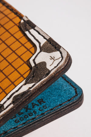 detail photo of multicolor four pocket vertical wallet with red, blue, yellow, and cowprint leather