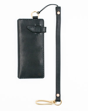 front top view of black leather eight pocket long wallet with two cash storage sleeves and brass lanyard