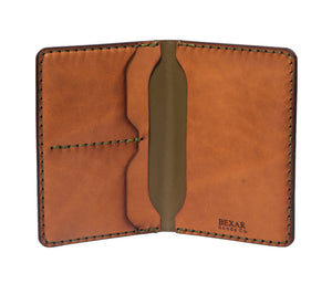 interior of green outer and brown inner leather passport wallet with two card pockets