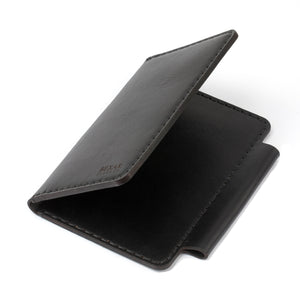 folded interior/exterior view of black leather notebook wallet with two card pockets and pen sleeve