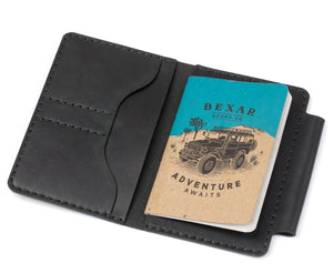 profile view of black leather notebook wallet with two card pockets and pen sleeve