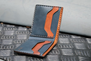 open interior view of blue and brown leather four card pocket bifold wallet