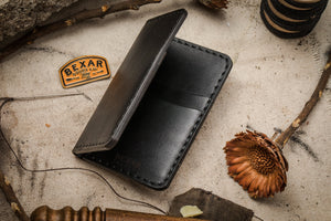 folded interior of black leather vertical four card pocket wallet