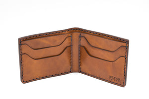 interior of blue cordovan and brown leather four pocket bifold wallet