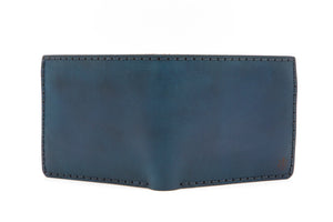 exterior of blue cordovan and brown leather six pocket bifold wallet