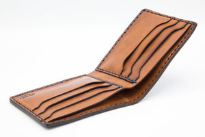 top profile of blue cordovan and brown leather six pocket bifold wallet