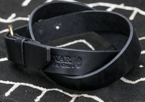 Closeup of Bexar Goods embossed logo on a black leather belt