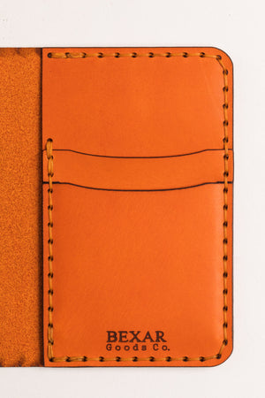 interior of four pocket vertical orange leather wallet 