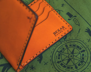 folded view of Orange six pocket bifold wallet