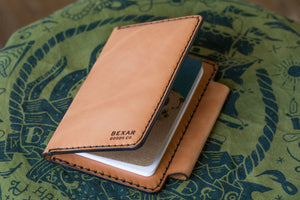 closed exterior view of russet brown color leather wallet with 4x4 vehicle notebook and two card pockets