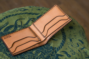 open interior view of russet brown color leather wallet with four card pockets