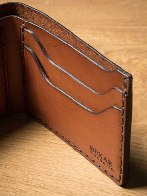 brown leather bifold with 4 card pockets and one cash sleeve 