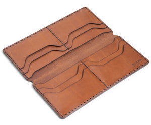 interior view of brown leather long wallet with eight card pockets and two cash sleeves