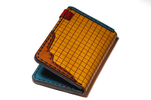 multicolor four pocket vertical wallet with red, blue, yellow, and cowprint leather