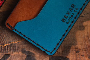 detail photo of blue and brown wallet with card sleeve and center divider