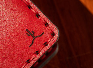 closeup detail shop of cactus engraving on front of wallet