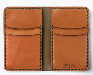 interior of green and brown leather four card vertical wallet