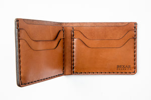 open interior brown leather bifold with 4 card pockets and one cash sleeve