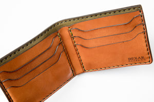 top interior view of green exterior and brown interior leather six pocket bifold wallet