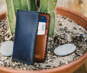 exterior/interior of blue cordovan and brown leather four pocket vertical wallet