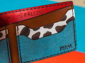 interior view of multicolor four pocket bifold wallet with red, blue, yellow, and cowprint leather