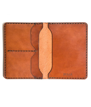 open interior view of brown leather passport wallet with two card pockets and internal sleeve