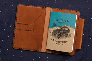 interior view of  brown leather notebook wallet with card sleeves and passport sleeve