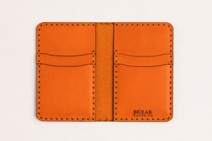 alternate interior view of four pocket vertical orange leather wallet 
