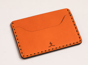 two pocket slim orange leather wallet with cactus engraving