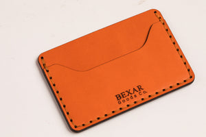 two pocket slim orange leather wallet