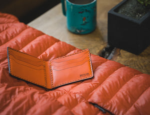 open interior view of Orange six pocket bifold wallet