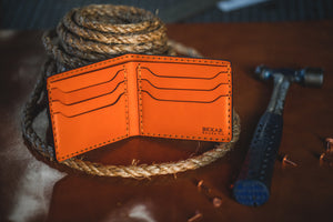 interior of orange six pocket bifold wallet