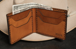 interior view of four pocket brown bifold wallet with cash coming out of cash sleeve