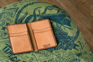 open interior view of russet colored brown vertical wallet with four card pockets