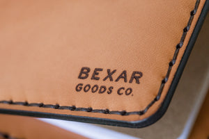 closeup view of russet brown color leather wallet with 4x4 vehicle notebook and two card pockets