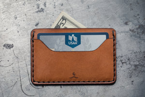 two pocket wallet showcasing card pocket and center divider for dollar bills