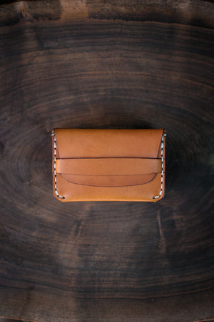 tan leather folding card wallet with leather closure