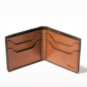 interior view of green exterior and brown interior leather four pocket bifold wallet
