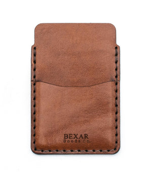 brown leather card holder with front sleeve and center sleeve