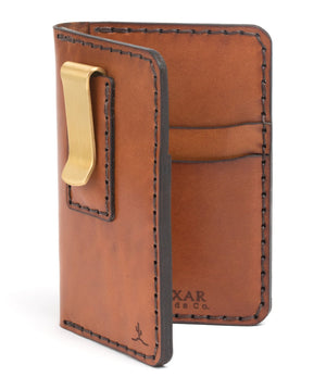 brown leather four pocket vertical wallet with brass money clip on exterior